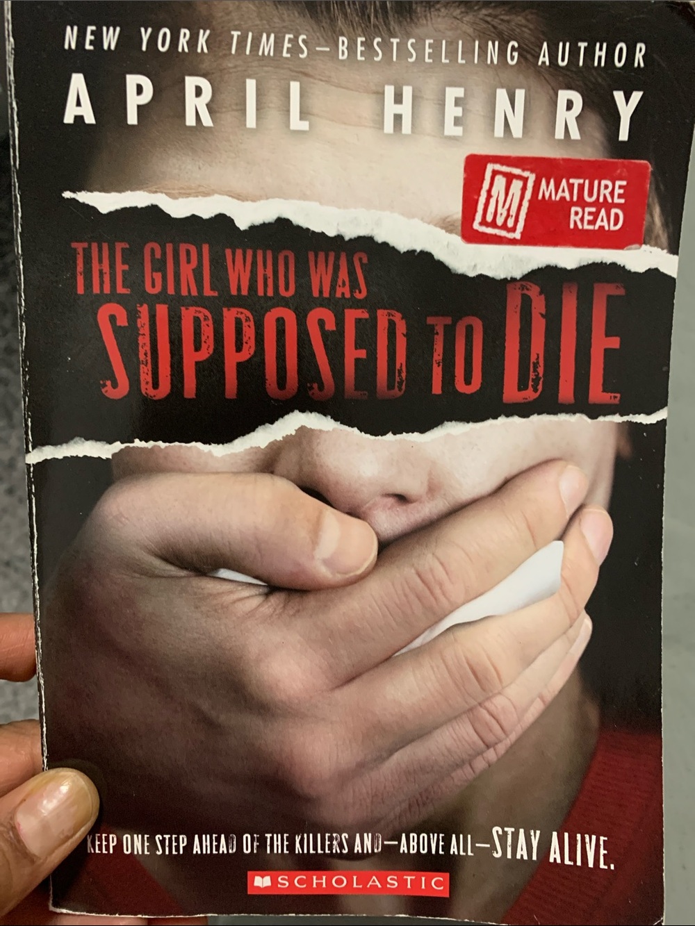 Scholastic Thriller Paperback with Black, Red and White Cover